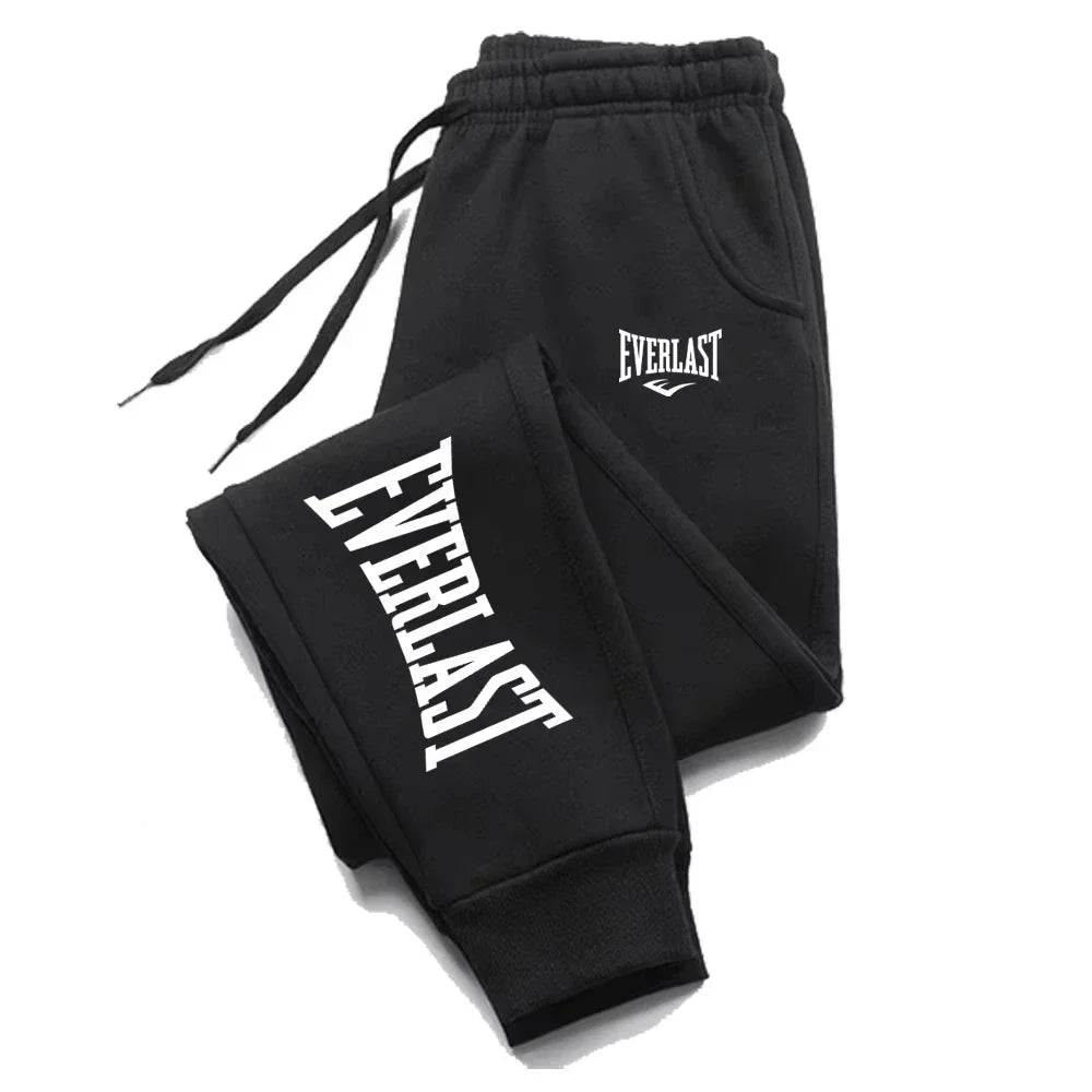 Black sweatpants with white "Everlast" logo on the leg and hip, featuring a drawstring waist.